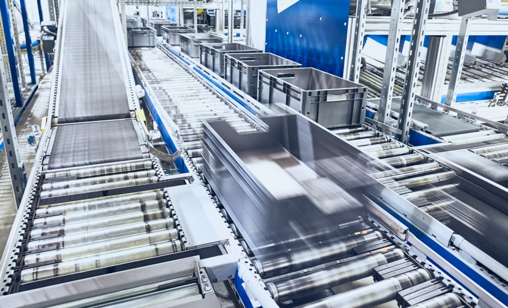 Modern conveyor system with boxes in motion.